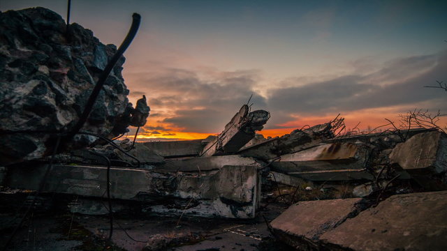 .Apocalypse.Sunset over the wreckage of buildings