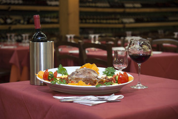 pork shank on a bed of polenta amatriciana