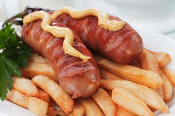 Grilled sausages and french fries