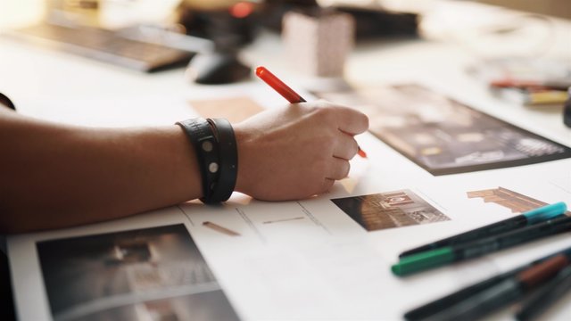 Architect working on blueprint close up