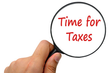 Time for Taxes word. Magnifier and puzzles.