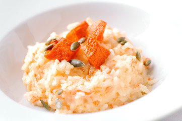 pumpkin rice porridge close-up on white plate