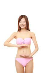 Obraz premium Woman with hands over belly