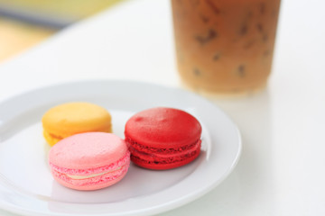 Sweet and colourful french macarons on white table