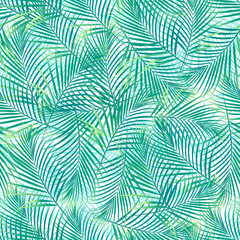 Tropical palm leaves in a seamless pattern on a white background