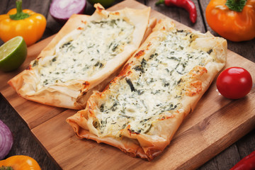 Fototapeta na wymiar Phyllo pastry filled with cheese and spinach