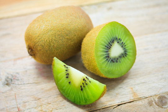 Fresh kiwi fruits on wooden table