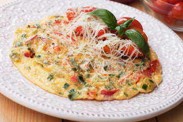 Omelet with cheese and cherry tomato