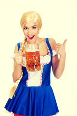 Bavarian woman with beer and thumbs up.