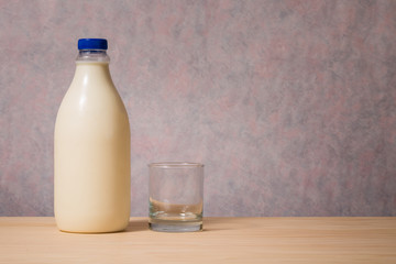 bottle of milk and empty glass