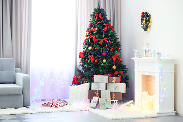 Perfect Christmas tree with gifts underneath in living room