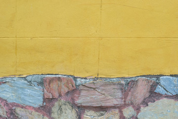 Yellow wall with stone texture