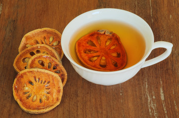 cup of bael juice on wooden background