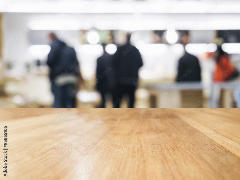 Wall mural Table top with Blurred People and Shop interior background