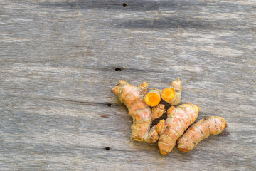 Group of turmeric on old wooden background
