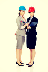 Architect woman signing contract.