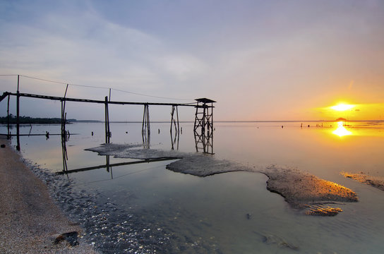 old bridge at jeram beach during sunset