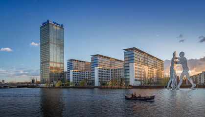 The Treptowers in Berlin Treptow with the Molecule man statue in front
