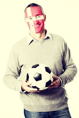 Mature man with Denmark flag on face.