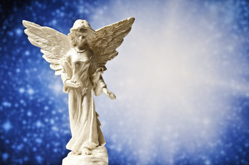 angel statue with divine light