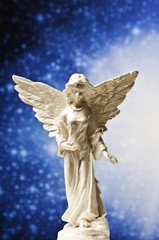 angel statue with divine light