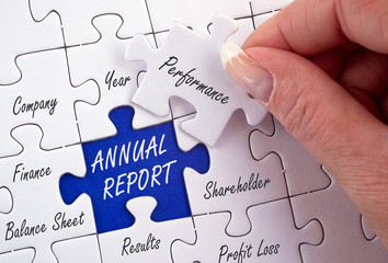 Annual Report - female hand with puzzle, business and finance concept