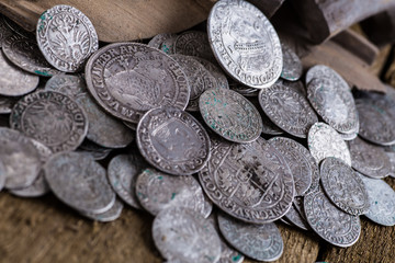 trove of ancient medieval coins silver background