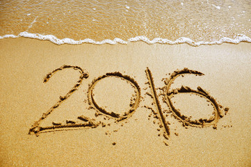 2016 written on the beach