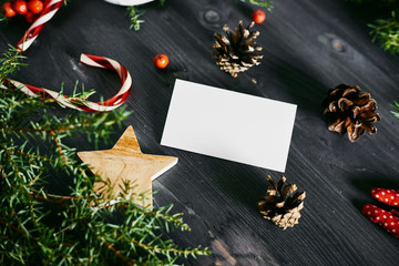 Blank business card on a Christmas wooden background.