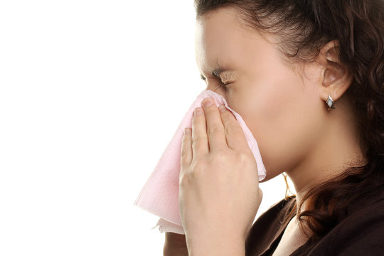 the girl with the runny nose on a white isolated background