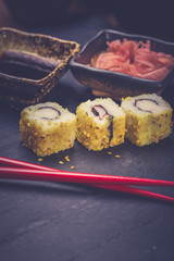 Closeup of fresh sushi on rustic wooden table