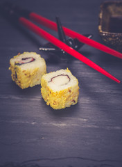 Closeup of fresh sushi on rustic wooden table