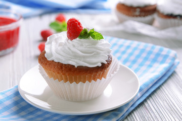 Delicious cupcake with berries on table close up