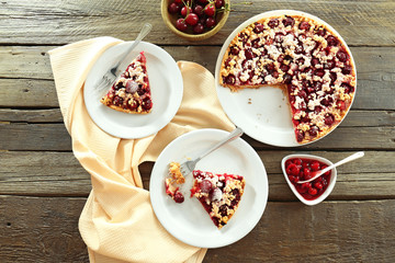 Tasty homemade pie with cherries on table close up