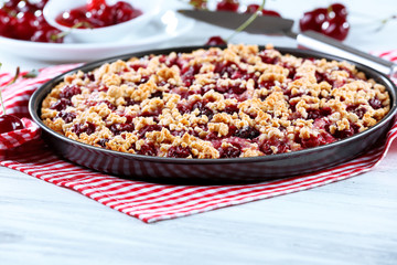 Tasty homemade pie with cherries on table close up