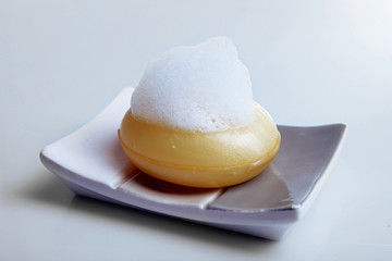 Soap with foam isolated on white