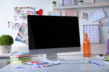 Modern workplace with computer on the table in decorated room