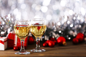 Champagne and Christmas decoration on bright background