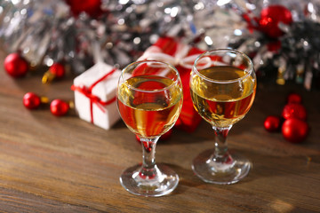 Champagne and Christmas decoration on bright background