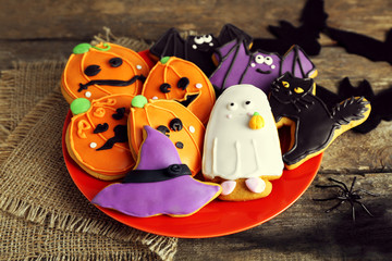 Creative Halloween cookies on wooden background