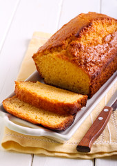 Citrus polenta cake, sliced on plate