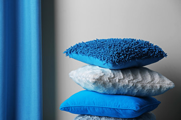 Multicoloured pillows in a room