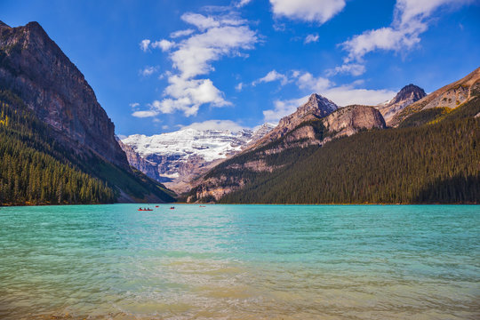  Lake Louise,  Rocky Mountains, pine forests and glaciers