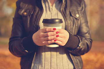 girl holding coffee cup