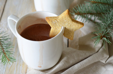 Cocoa drink with hanging mug cookies