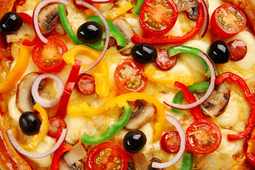 Delicious pizza with vegetables, on wooden table, close-up