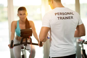 Schilderijen op glas Personal trainer at the gym © luckybusiness