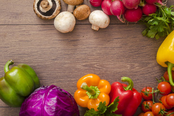 various vegetables in a circle on the wooden floor