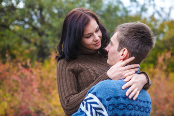 Fototapeta premium girl at the hands of Man. A loving couple walking in the autumn