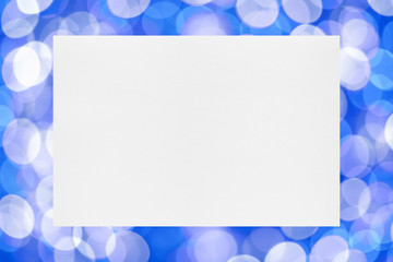 Sheet of paper on holiday lights background